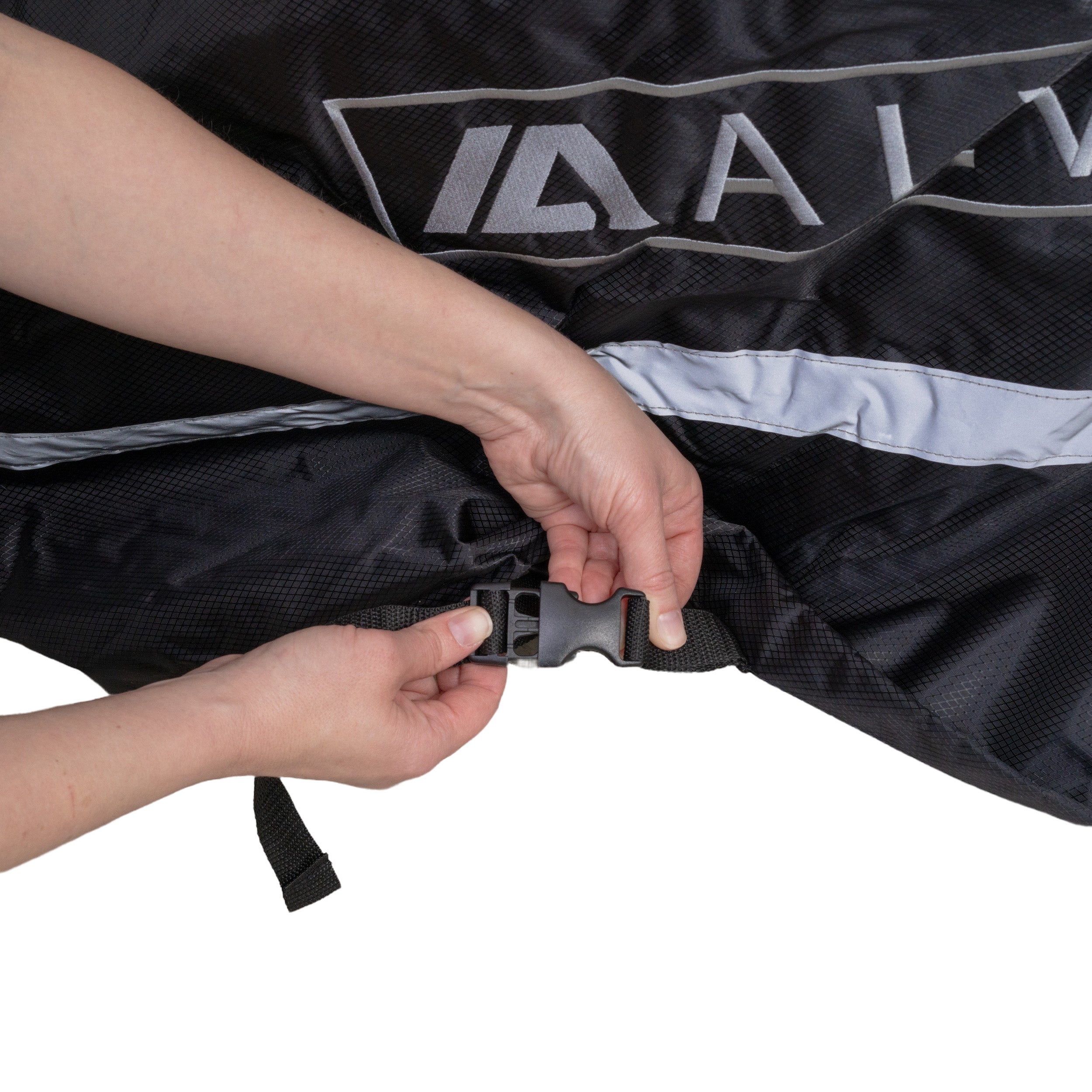 Hands holding the Universal Deluxe Electric Bike & Scooter Weatherproof Cover, showcasing its sturdy 600D polyester material and secure drawstrings for protection against dust, rain, and snow.