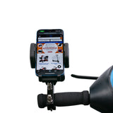 Universal Grip Smartphone Holder securely attached to a scooter handlebar, showcasing its adjustable wings gripping a phone screen. Ideal for mobility scooters, power chairs, and wheelchairs.