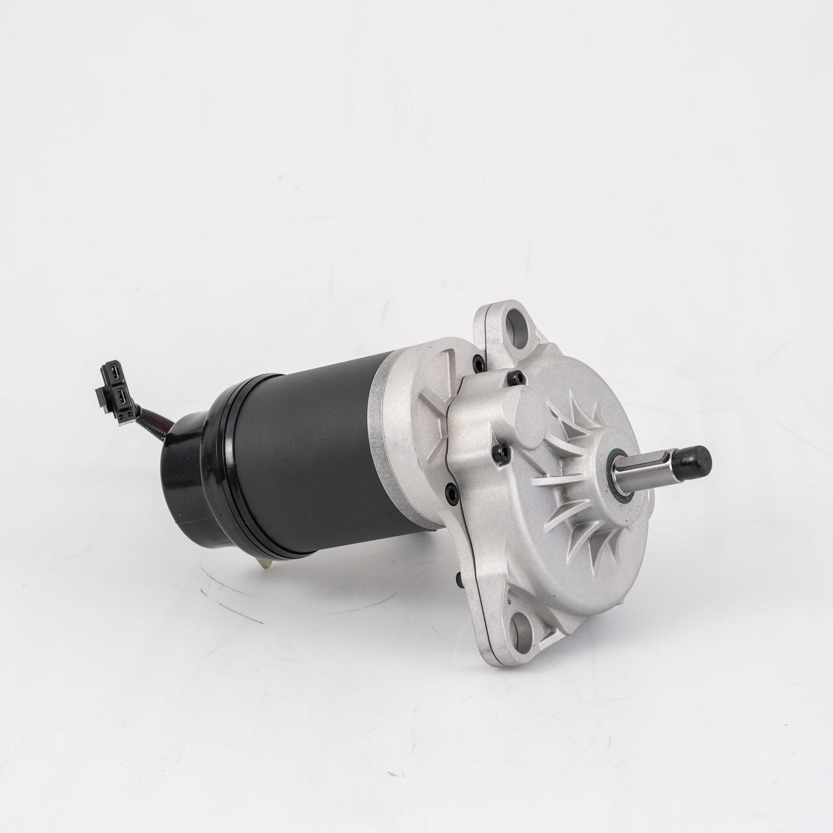 Left Motor and Gearbox Assembly with Freewheel and Mounting Hardware for the Jazzy Select, featuring a compact metal and black electric motor with visible mechanical components.