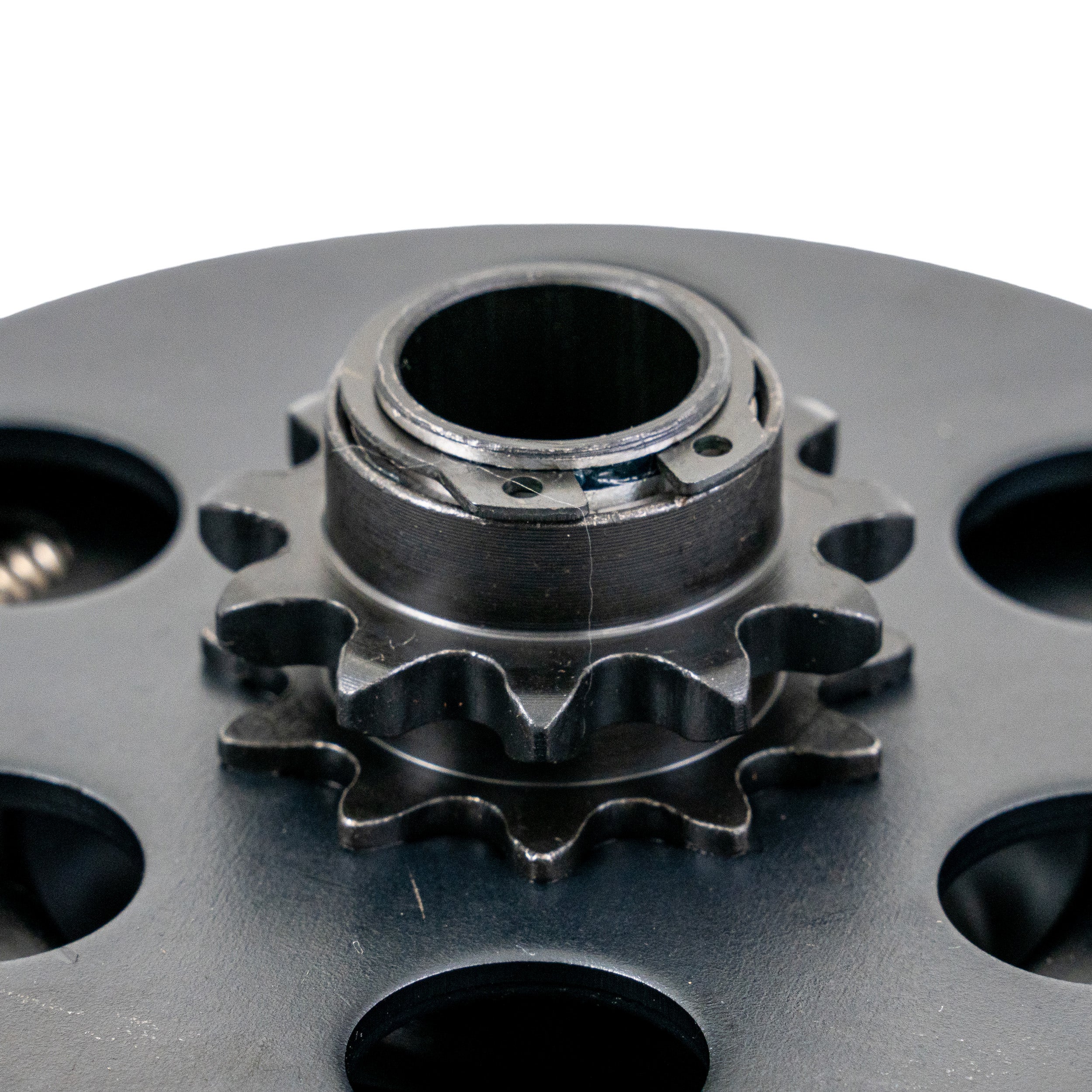 Close-up of the Clutch Assembly with Front Sprocket for Baja Doodle Bug (DB30), showcasing the metal gear and 11-tooth front sprocket, essential for power transfer in the mini bike.