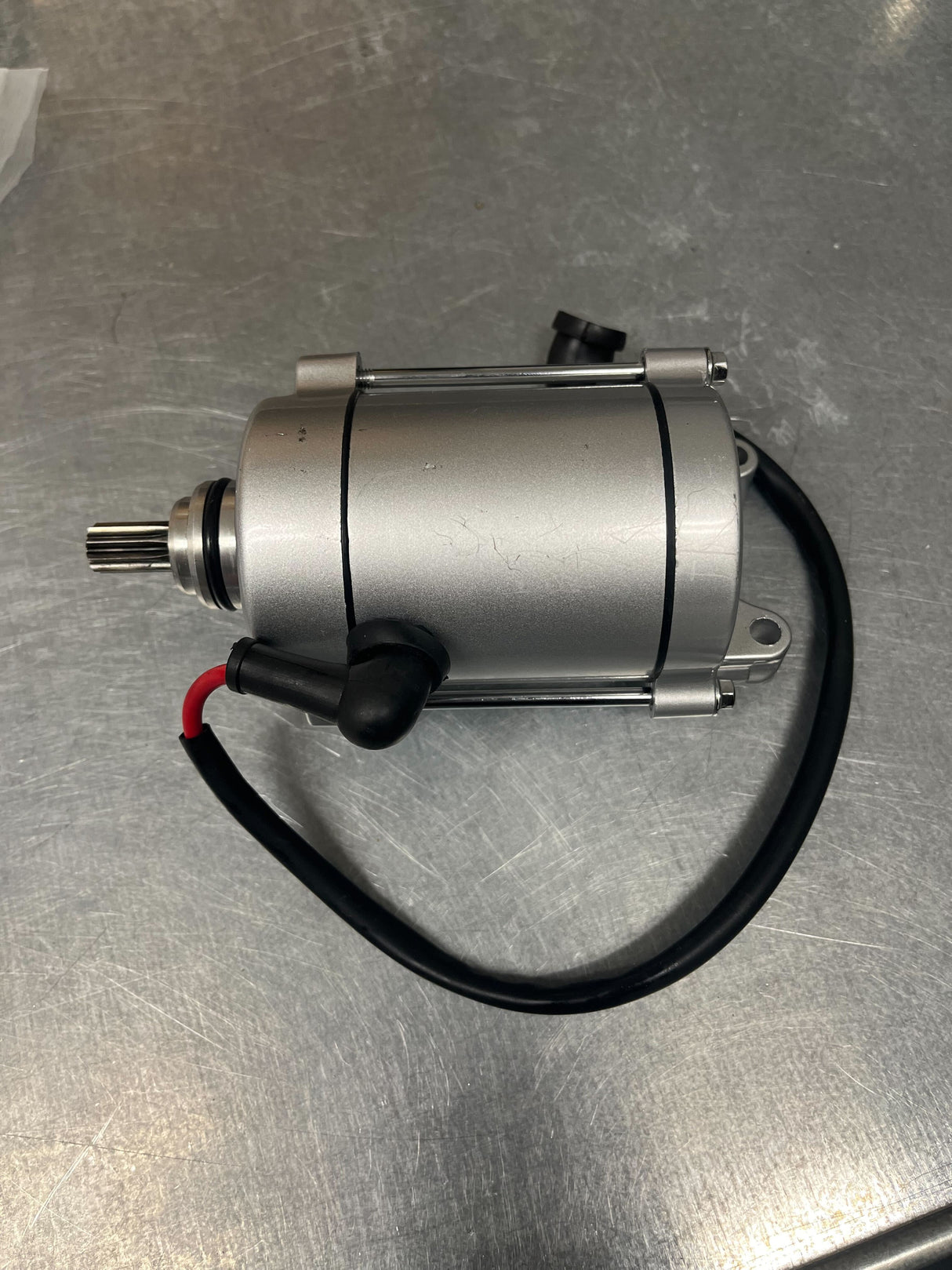 9 Tooth Starter Motor for 125cc/150cc, 250cc & 400cc ATVs, Dirt Bikes, & Go Karts (Blemished) featuring a silver metal cylinder with black wire.