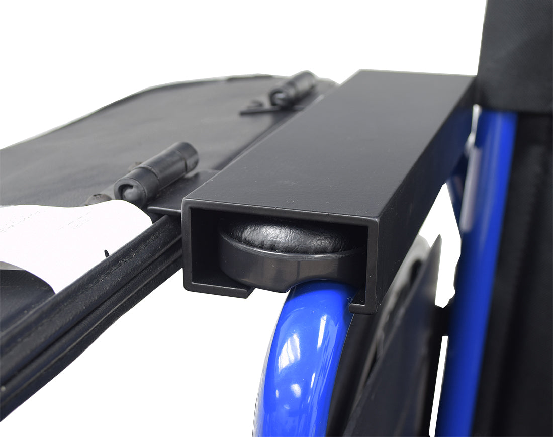 Universal Padded Black Vinyl Half-Lap Flip-Up Tray for Wheelchairs, shown attached to a standard padded armrest, demonstrating its practical flip-up feature and easy mounting mechanism for enhanced convenience.