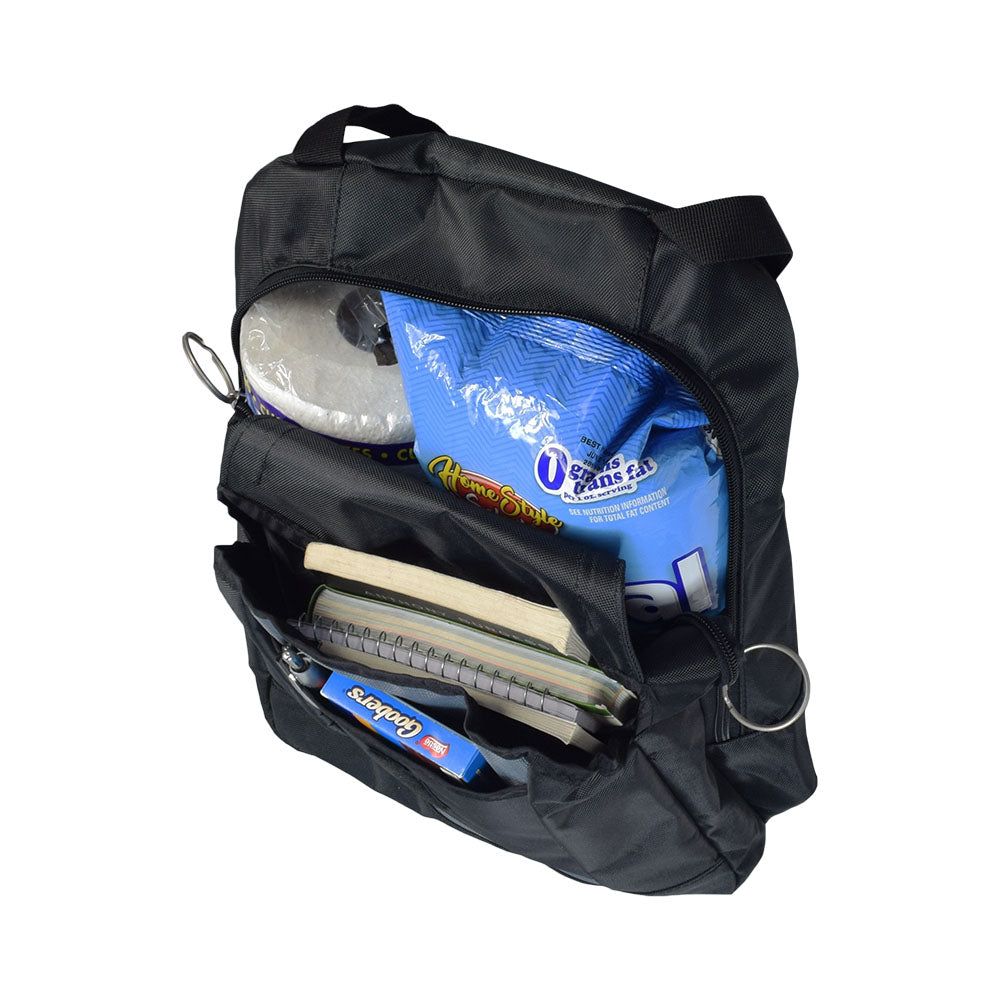 17x14 Backpack for Wheelchairs with six storage areas, visible items including a notebook, candy bar, chips, and toilet paper. Features adjustable straps and easy pull O rings on zippers.