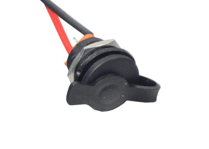 Close-up of the Coaxial Charging Port for the Gyroor C3 Electric Bike, featuring black and red wires, a 5.5 mm female coaxial aperture, and a weather-proof rubber cover for protection.