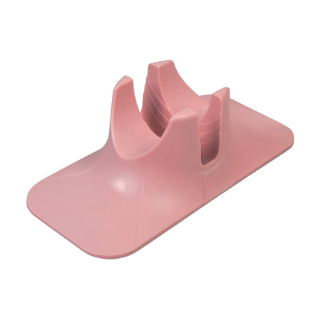 Kick Scooter Stand designed to hold a scooter's wheel upright, featuring a pink plastic construction with holes for additional support.