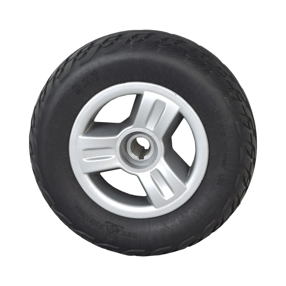 9x3 Black Flat-Free Rear Wheel Assembly for the Go-Go Elite Traveller (Set of 2), showcasing a close-up of a black tire with a silver rim, emphasizing its robust tread and quality finish.