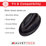 Bicycle Trainer Riser Block for Bike Front Wheels: A black rubber object designed to stabilize and level the bike's front wheel during training, equipped with four non-slip pads for a secure setup.