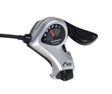 7 Speed Right Thumb Gear Shift Lever for Bicycles, close-up of the Shimano gear shifter handlebar mount, displaying speedometer with numbers, red needle, and black cable.