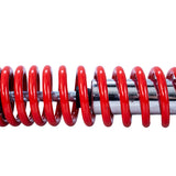 12-3/4 (325 mm) Adjustable Shock with 10 mm Eyes for 150cc - 250cc Hammerhead Off-Road® Go-Karts (Set of 2) (Blemished): Close-up of a red coil spring, highlighting its metal construction.