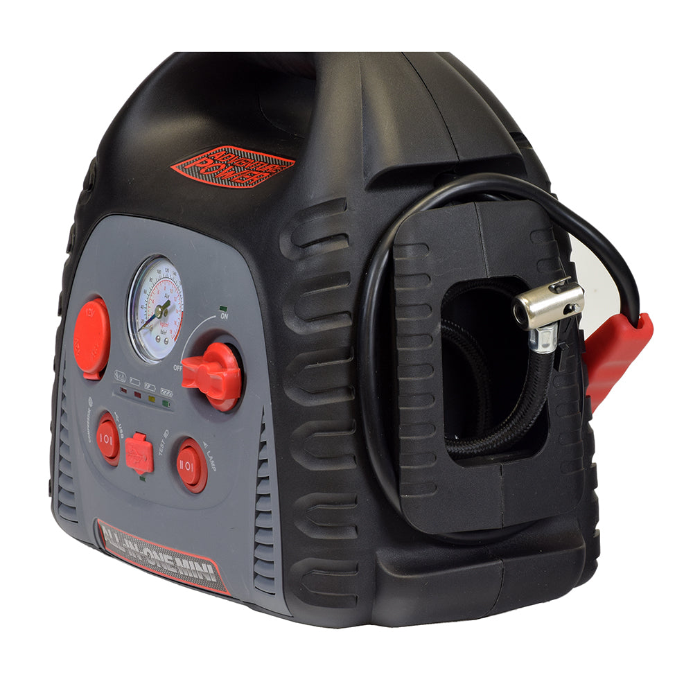 Adventure Power Automobile Battery All-in-One Trickle Charger, Jump Starter, & Compressor features red buttons, a gauge, a black plastic tube with a silver hose, and an air pump for emergency use.