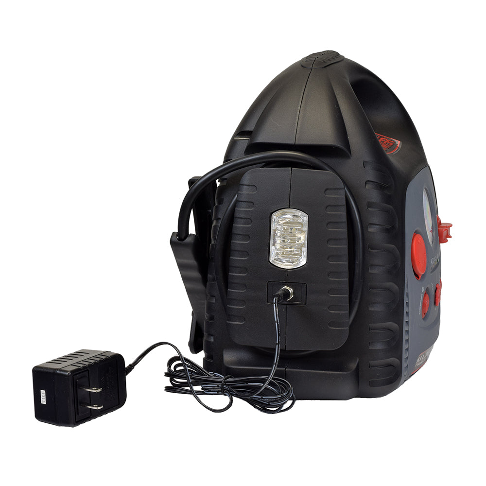 Adventure Power Automobile Battery All-in-One Trickle Charger, Jump Starter, & Compressor featuring red buttons, a black and grey body, thick cables, an electrical plug, and an air pump.