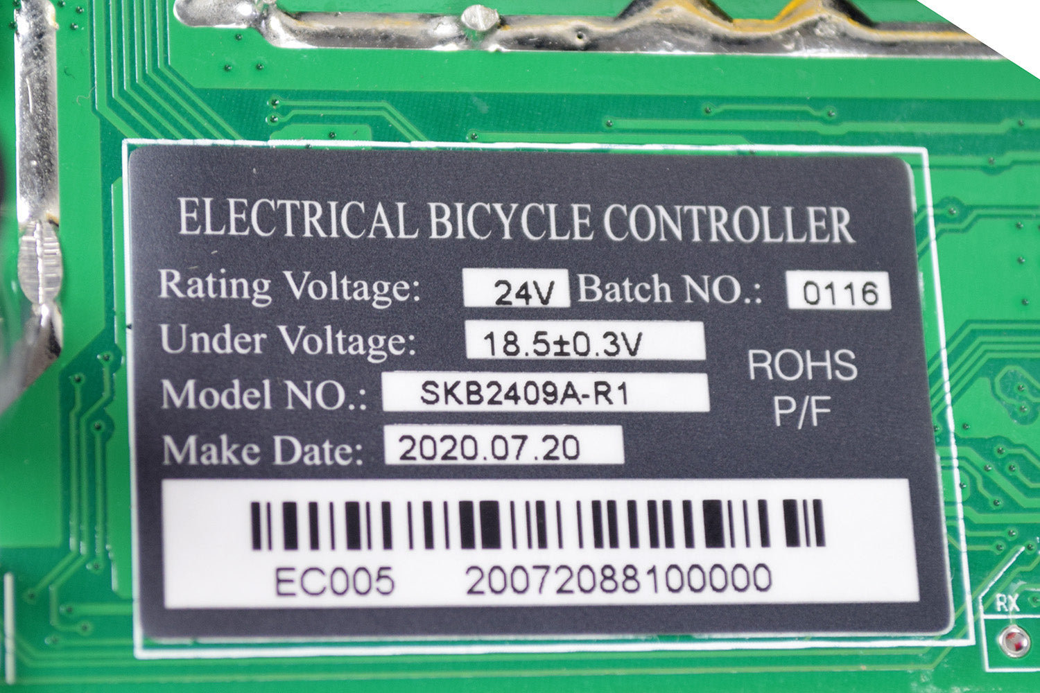 Motherboard (PCB) for RazorX Electric Skateboards displaying various components, including a green circuit board with labels, bar code, numbers, and connectors, essential for receiving and transferring control signals.