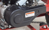 Plastic Clutch Cover for Coleman CC100X & CT100U Mini Bikes mounted on a motorcycle, showcasing close-up metal parts and a visible warning label.