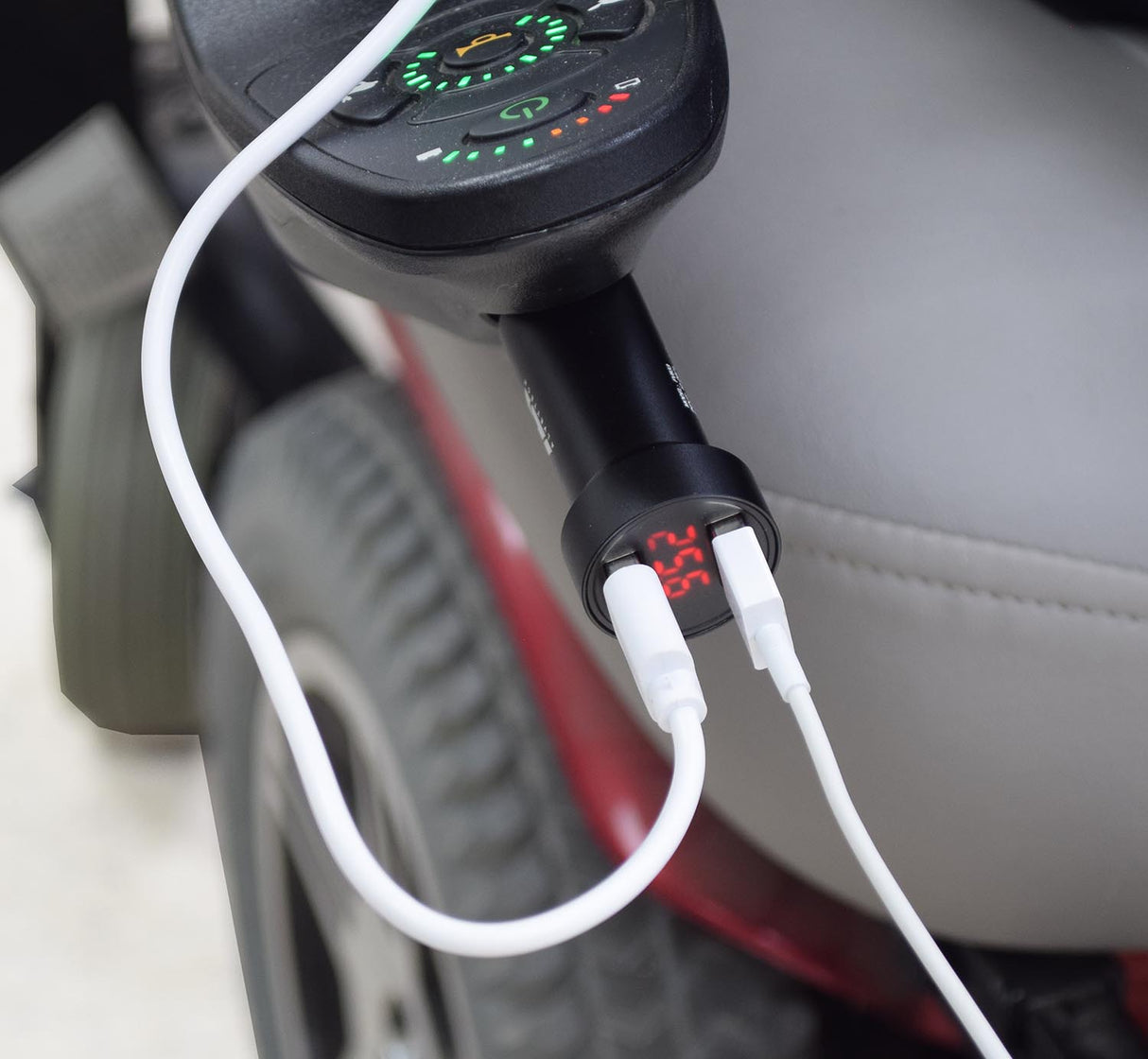 Close-up of the AlveyTech XLR Dual Port USB Charging Adapter with Digital Voltage Meter, showing two USB ports and a red digital display, designed for scooters and power chairs.