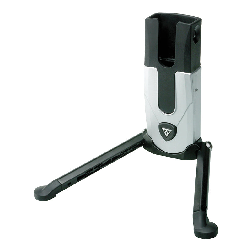 FlashStand Fat Portable Bike Repair Stand by Topeak: A compact, black and silver stand designed for holding mountain bikes upright, featuring a sleek, foldable structure for easy portability and strong aluminum construction.