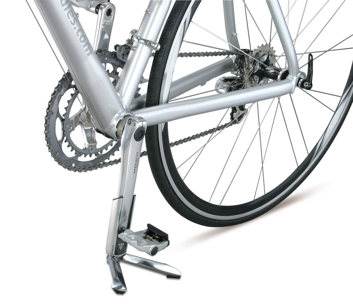 FlashStand Slim Portable Bike Repair Stand shown in use, propping up a 700c road bike by its crank arm with visible rear wheel, chain, and pedal details.