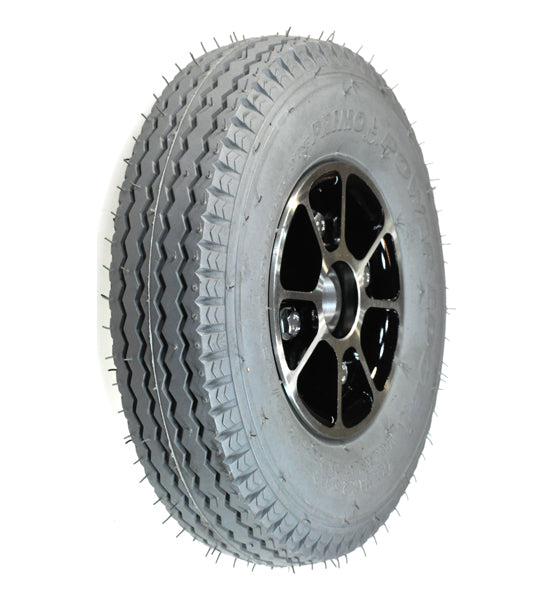 9x3 (2.80/2.50-4) Flat-Free Rear Wheel Assembly for the Pride Rally (SC150/SC151/SC155) featuring a spiked tread pattern for enhanced traction.