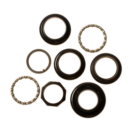 Front Anti-Tip Fork Bearings for the Rascal 312 Turnabout; close-up of various circular black metal components essential for power chair performance.