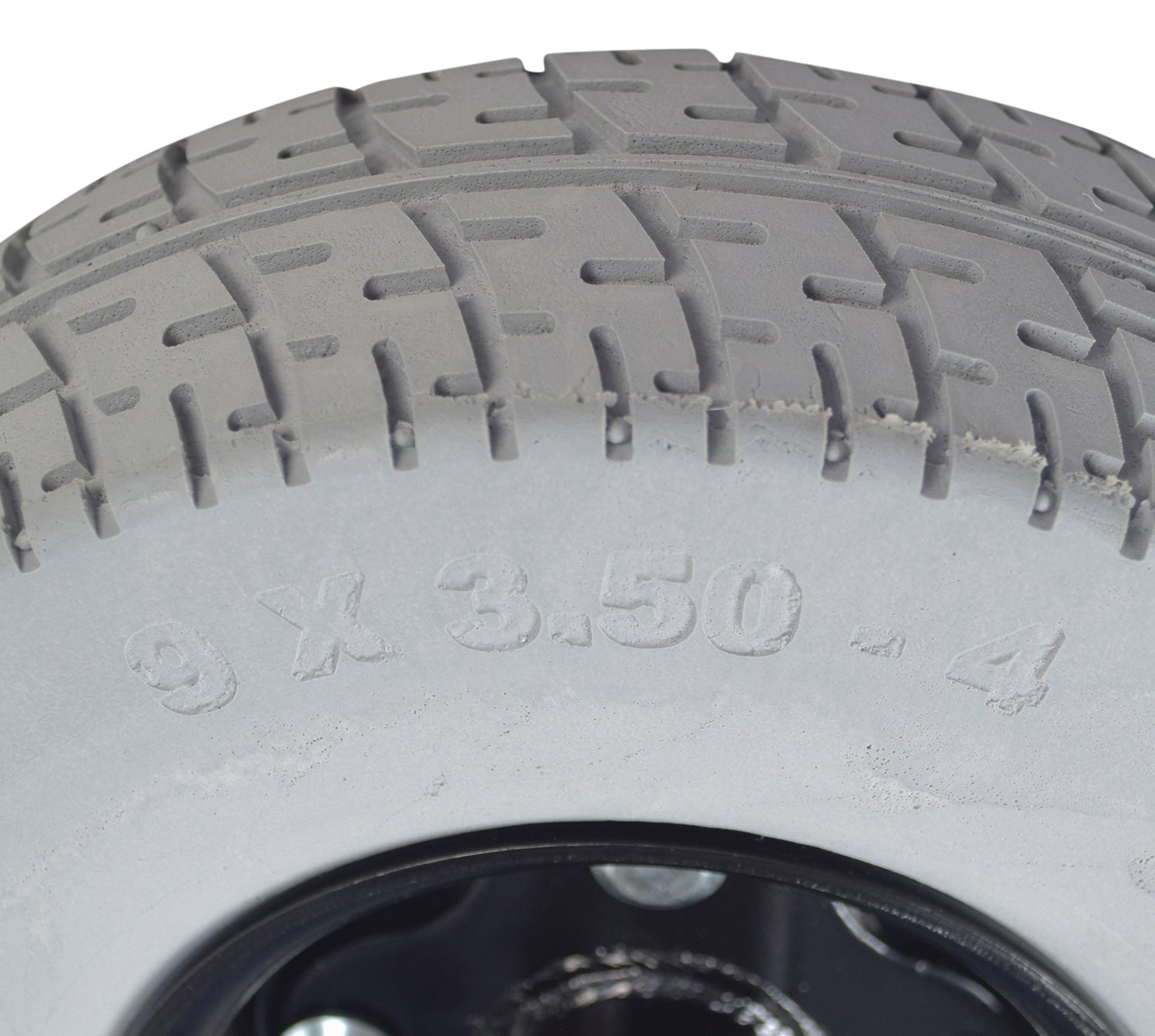 Close-up of the 9 x 3.50-4 Foam-Filled Rear Wheel Assembly for the Golden Technologies Companion I (GC221/GC222/GC223), showcasing the tire's tread and non-marking gray rubber surface.