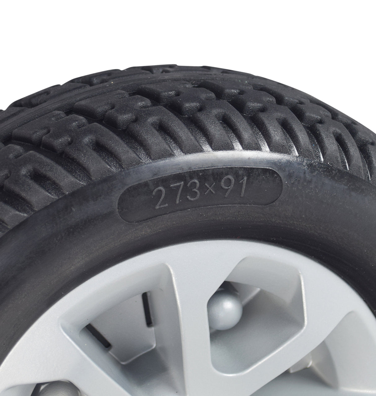 Close-up of the Rear Wheel Assembly with Matte Silver Cover for the Golden Companion (GC440) mobility scooter, featuring a solid flat-free tire and detailed tread pattern.