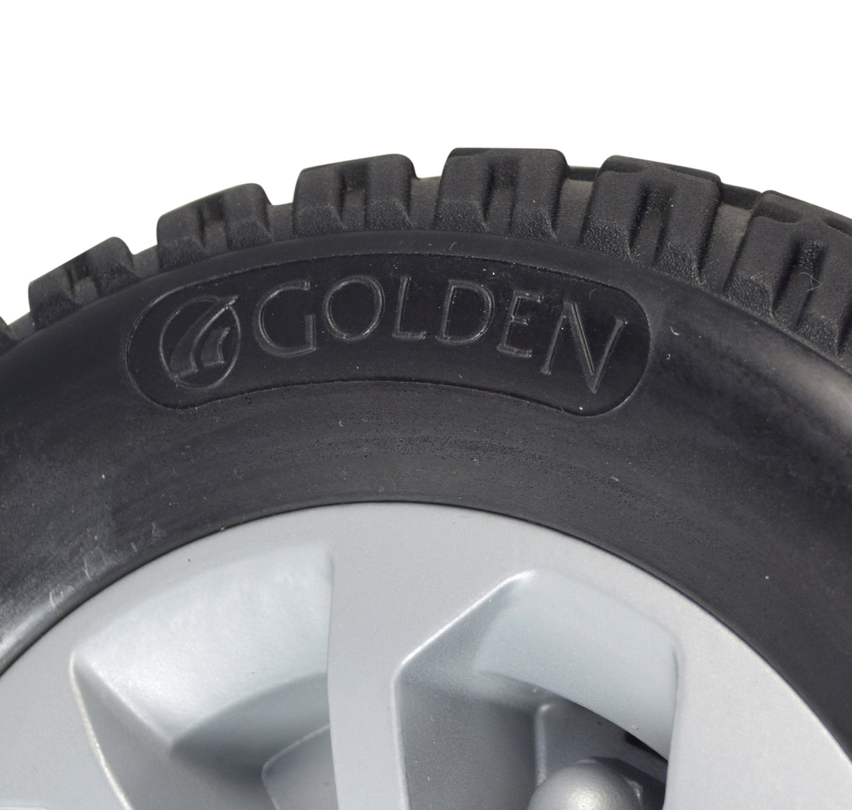 Close-up of the Rear Wheel Assembly with Matte Silver Cover for the Golden Companion (GC440) mobility scooter, highlighting the solid flat-free tire and detailed tread pattern.