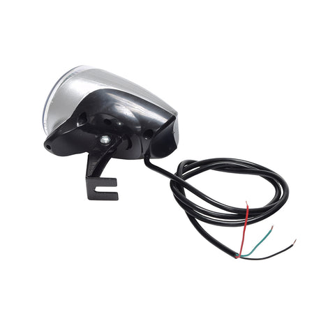 12 Volt Chrome LED Headlight Assembly close-up, showing its compact 3 wide, 4 deep body, and connected black wire with red and green wires, ideal for gas scooters, mini choppers, and mini bikes.