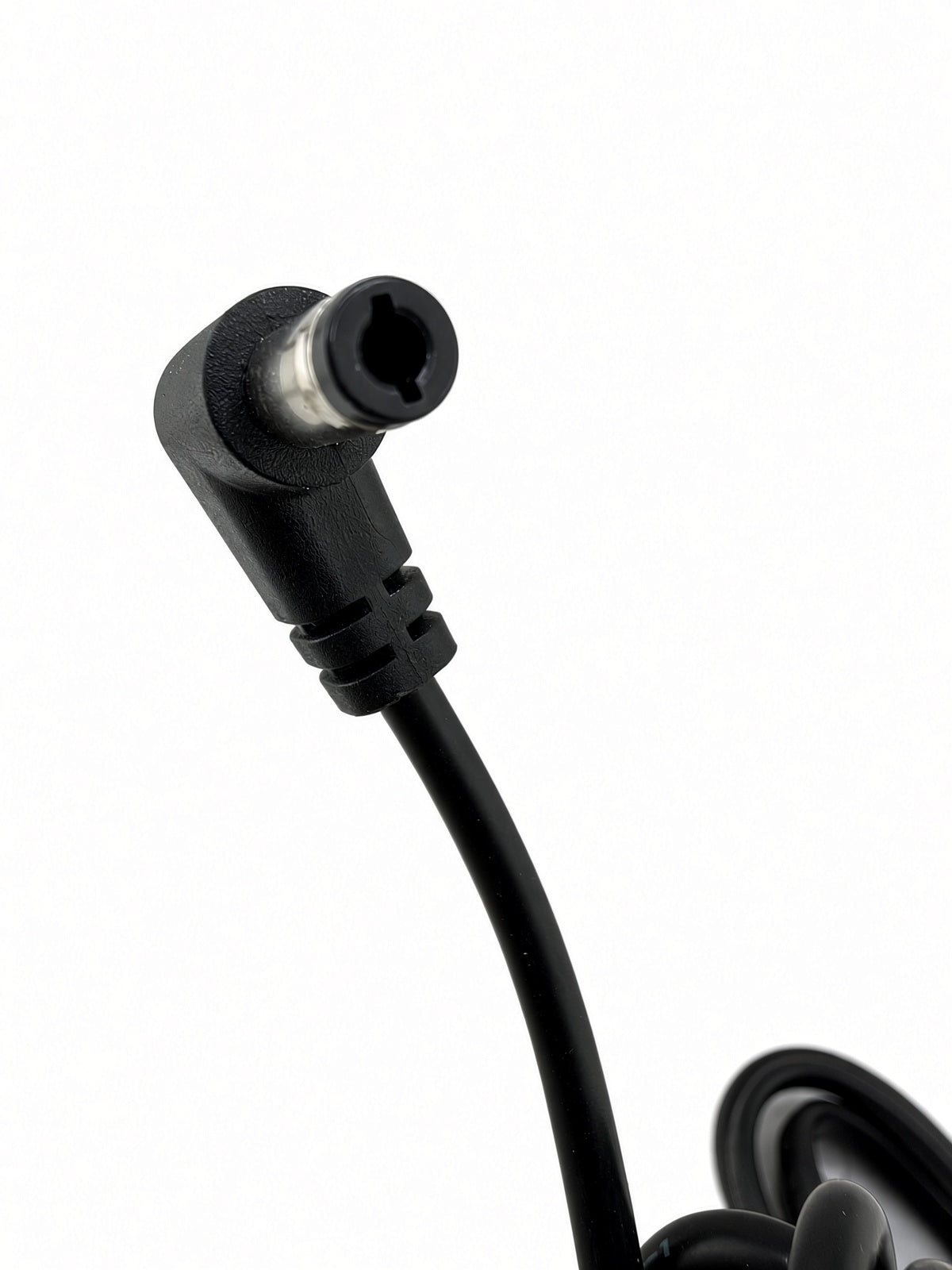 Close-up of the right-angle coaxial DC barrel charging plug on the Hiboy DK1 charger