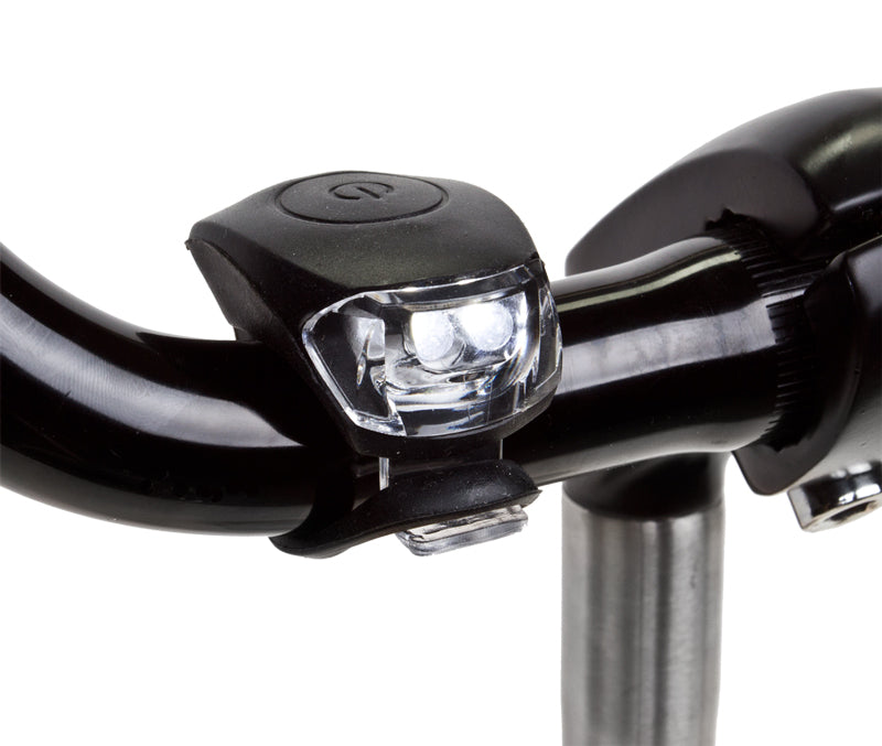 Close-up of the HL-L210 Griplite Headlight, showcasing its sleek metalware design, suitable for bikes and scooters.