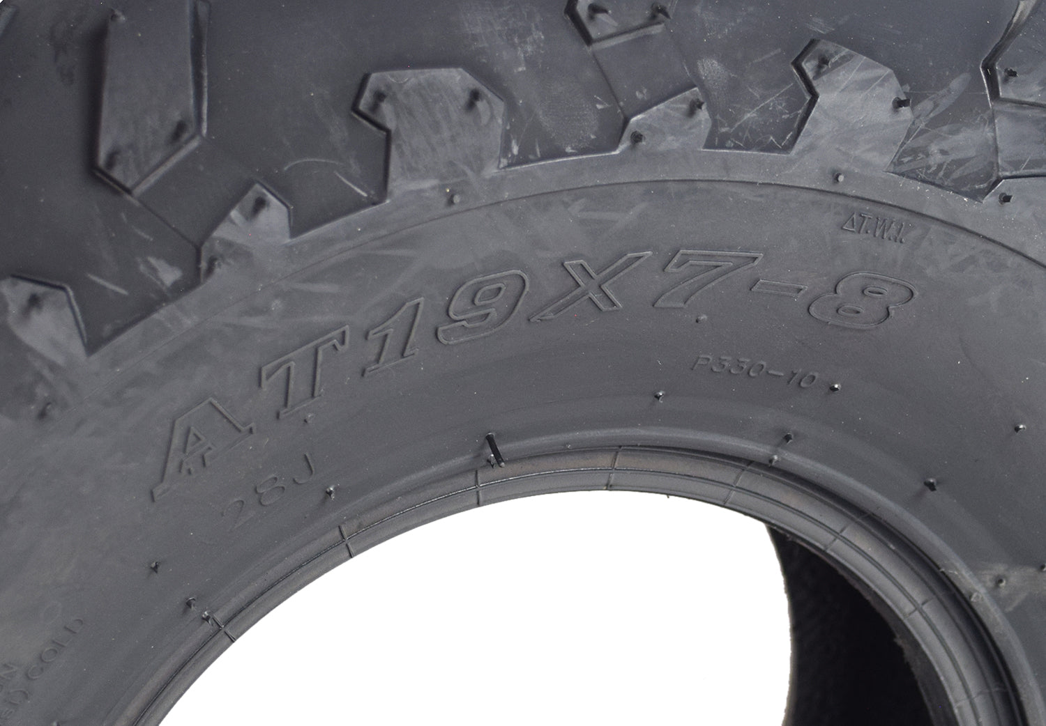 Close-up of a 19x7.00-8 knobby tire with P330 tread for Baja MB165 & MB200 mini bikes, highlighting the rugged, knobby tread pattern designed for enhanced traction and control.