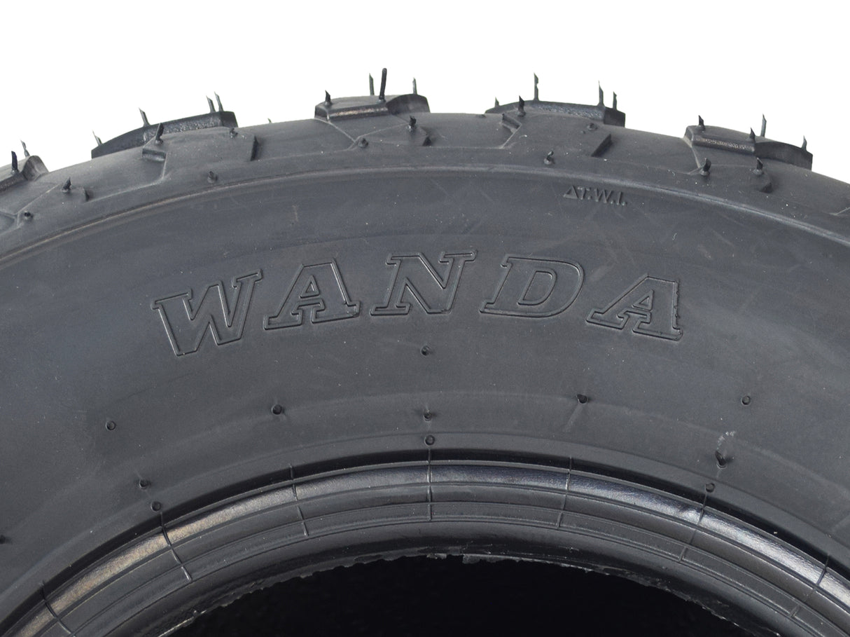 Close-up of a 19x7.00-8 knobby tire with P330 tread for Baja MB165 & MB200 mini bikes, showcasing its rugged, spike-patterned tread to emphasize traction and control on various terrains.