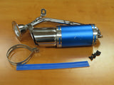 Blue Short Performance Exhaust System for GY6 150cc Scooters & Go-Karts, featuring a blue muffler, pipe, clamp, and mounting hardware on a wood surface. Visible minor scratches; gasket missing.