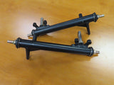 Left & Right Strut Spindle for Kandi 110GKG-2 & TaoTao GK110 Go-Karts (Pair) (Blemished) displayed on a wood surface, featuring black metal rods and frames with visible bolts and screws.