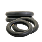 Inner Tube with Angled Valve Stem for ATVs & Dirt Bikes, shown in a stack of black tires with a brass valve stem, highlighting its durability and ease of inflation.