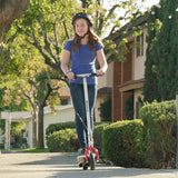 Girl riding a scooter outdoors, highlighting the 200x50 (8x2) Scooter Inner Tube with Angled Valve Stem, essential for various electric scooters, mobility scooters, and utility carts.