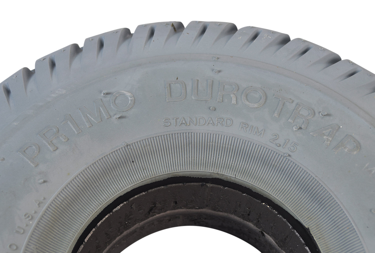 Close-up of Primo 3.00-4 (10x3, 260X85) foam-filled mobility tire with Durotrap C9210 tread, showcasing detailed tread pattern and smooth surface, designed for optimal indoor and outdoor performance.