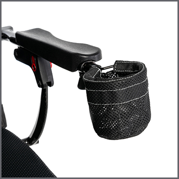 Cup Holder Assembly for the Jazzy Carbon Power Chair mounted on handlebar, featuring a black mesh bag with white stitching designed to securely hold various cup sizes.