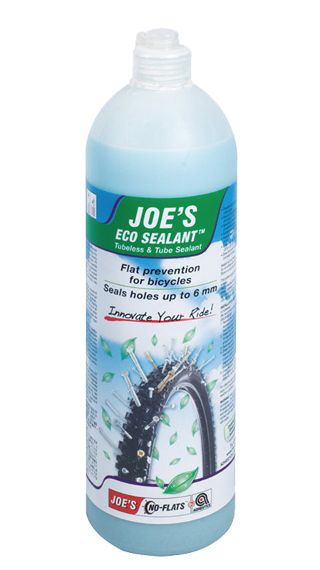 Joe's Eco Sealant - 1000 ml Bottle: A close-up of a plastic bottle of latex-free bicycle sealant designed for tubeless tires, featuring an easy-to-use spout and micro-sealing particles for quick puncture repair.