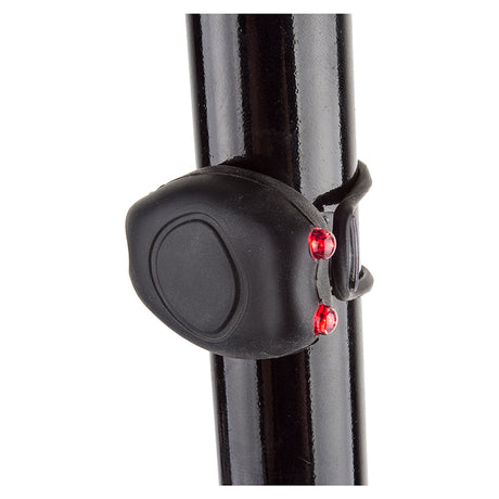 Close-up of Beam Bug Multi-Function Taillight attached to a bike pole, showcasing its compact design and essential safety function for bicycles and scooters.