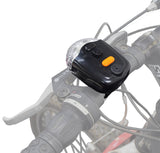 Battery Operated Brake Light & Turn Signal Taillight Assembly with Horn mounted on a bicycle handlebar, showing close-up of control panel and brake light with visible turn signals and horn buttons.