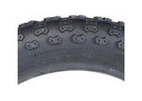 14x2.125 (57-254) Pneumatic Tire for Electric Bikes featuring a knobby tread pattern, ideal for both soft ground and hard concrete riding. Close-up view highlights the tire's durable synthetic rubber construction.