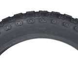 Close-up of a 14x2.125 Black MX3 Bicycle Tire with K50 Tread, showing detailed knobby tread pattern.