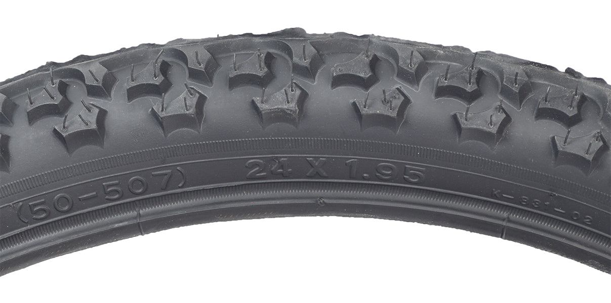 24x1.95 Black MTB Alpha Bite Bicycle Tire with K831 Tread, featuring large, widely spaced knobs ideal for hardpack, mud, or loose sand on dirt trails. Close-up shows intricate tread pattern.