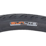 26x1.5 Black Flat Shield MTN Bicycle Tire by Sunlite, featuring black tread and an orange logo, designed for durability and performance on mountain terrain.