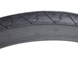 26x1.95 Black City Slick Bicycle Tire from Sunlite with distinctive tread pattern for enhanced grip.