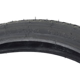 16x1.75 Black Street Bicycle Tire by Sunlite, showing close-up of the tread pattern and the number 6 carved on the side. Ideal for replacing old bike tires.