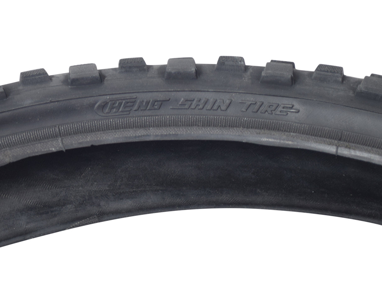 20x2.0 Black Caesar CST1244 Bicycle Tire with a distinct tread pattern, designed as a replacement bike tire from Sunlite, shown in a close-up image highlighting its rubber texture and tread details.