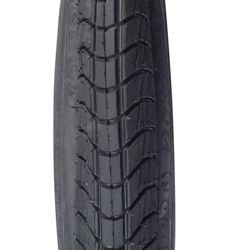 Close-up view of the 20x2.25 Black Freestyle Kontact Kick Scooter Tire with K841 Tread, featuring its distinctive wrap-around tread pattern for enhanced traction and control.