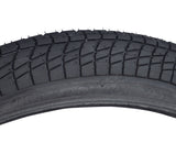 20x2.25 Black Freestyle Kontact Kick Scooter Tire with K841 Tread, showcasing close-up details of the wrap-around tread pattern and knurled surface for enhanced traction and control.