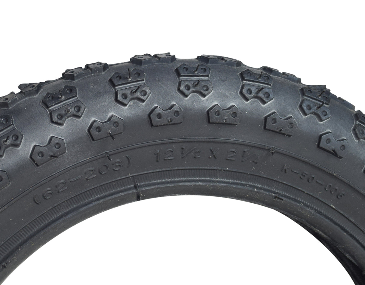 12-1/2x2-1/4 MX3 Bicycle Tire by Sunlite, showcasing detailed tread pattern and sturdy black rubber construction for reliable bike performance.