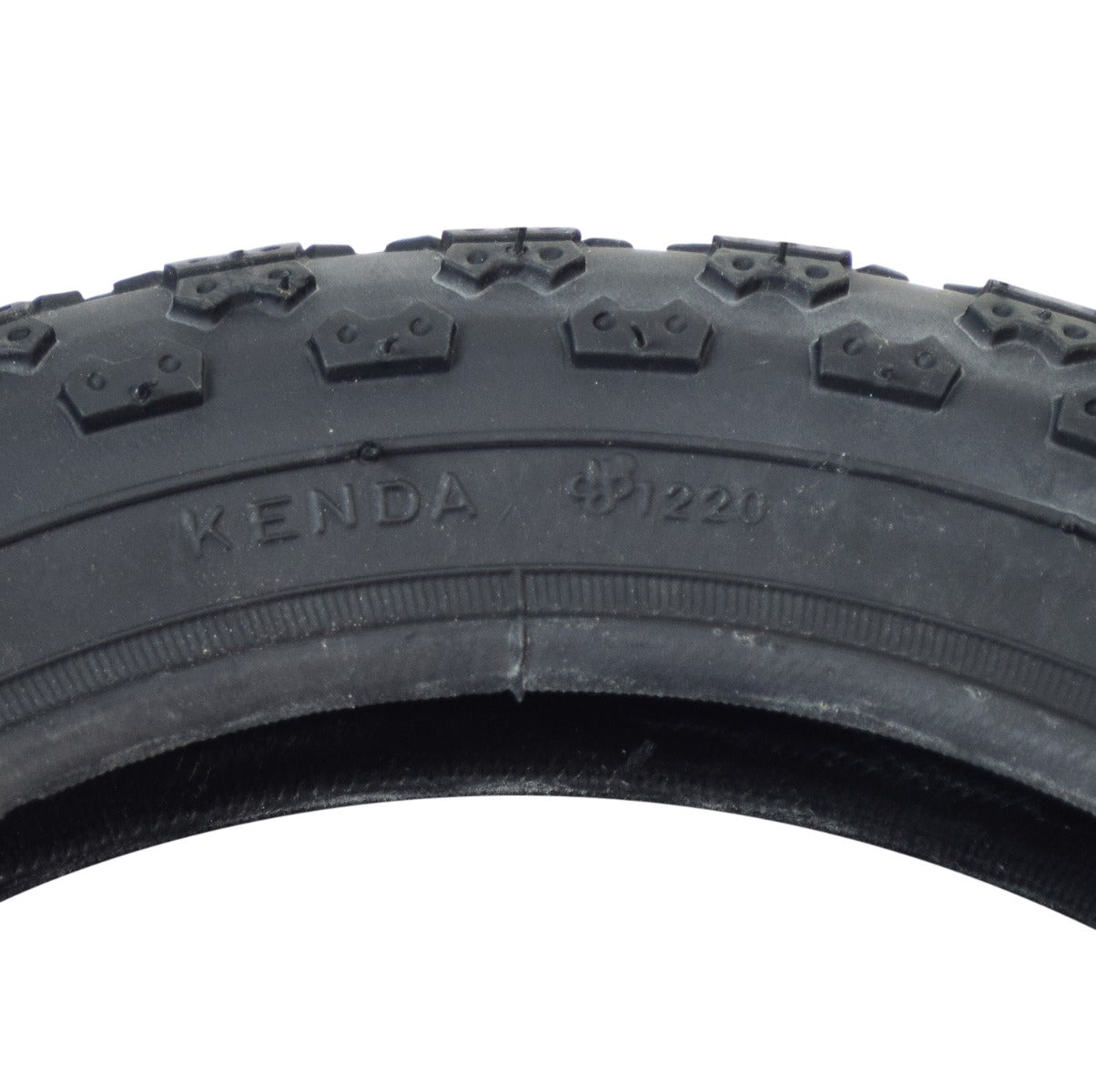 Close-up of the 12-1/2x2-1/4 MX3 Bicycle Tire by Sunlite, showcasing the tread pattern and surface texture, ideal for bike tire replacement.